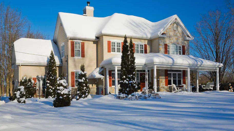 house-covered-snow-sunny-day